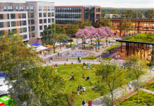 Growing a Neighborhood Around 130th Street Station A rendering shows a green space next to a plaza with a fountain where people are gathering. The top portion of the rendering show six story mixed use building and another five story mixed use building. There is a small building with a green roof on the right side.