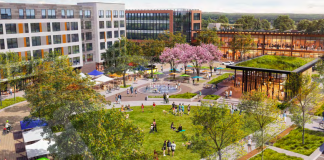 A rendering shows a green space next to a plaza with a fountain where people are gathering. The top portion of the rendering show six story mixed use building and another five story mixed use building. There is a small building with a green roof on the right side.