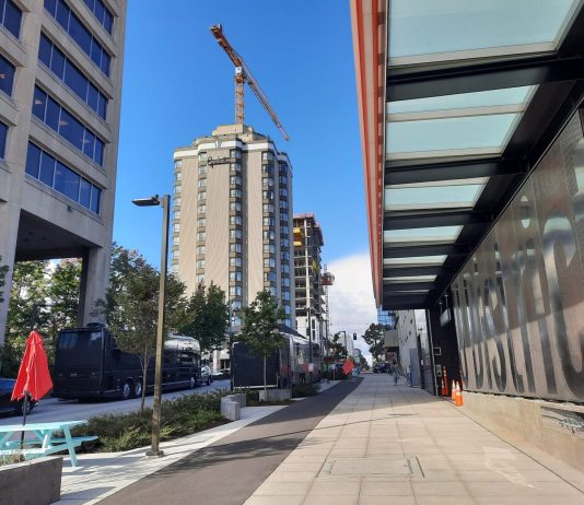 U District Is a Hive of Construction Activity as Light Rail Arrives Brooklyn Avenue looking north with UW Tower on the left and a new 24-story tower rising behind the Graduate Hotel.
