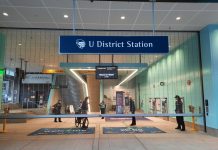 All Aboard The Urbanist’s Fall 2021 Subscriber Drive A bicyclist exists the 43rd Street gate of U District Station.