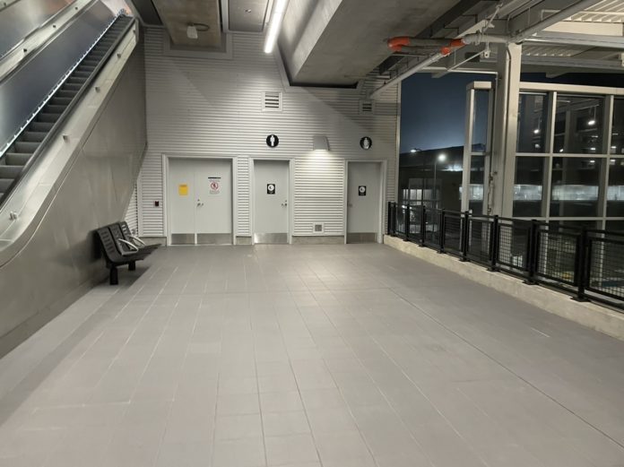 A photo showing doors for restrooms at a light rail station.