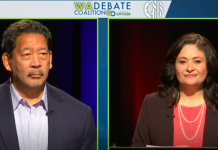 NPI Poll Finds Uphill Fight for Progressives in Seattle General Election A photo shows a man with greying black hair and mustache on the left side of the screen and a woman with shoulder length black hair and a red shirt beneath jacket on the right side of the stage.