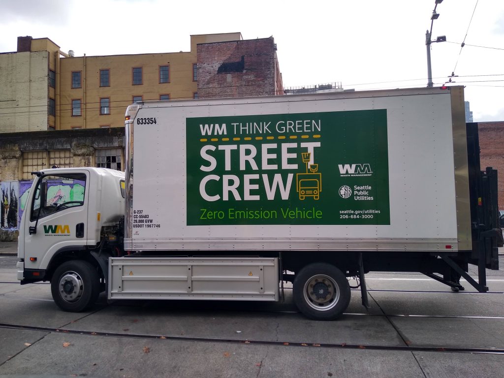 Box truck with Waste Management branding labelled Zero Emission Vehicle