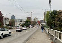 Support a Safe Crossing Over I-5 on NE 45th Street A photo of a sidewalk next to a busy roadway.