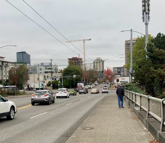 Support a Safe Crossing Over I-5 on NE 45th Street A photo of a sidewalk next to a busy roadway.