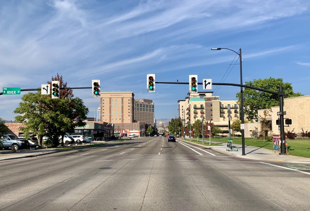 A photo four lane one way street with a bike lane. 