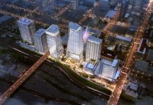 ULI’s Fall 2021 Meeting Predicts the Future of Cities Rendering of five glassy towers, viewed from above, and lit up among a darkened city.