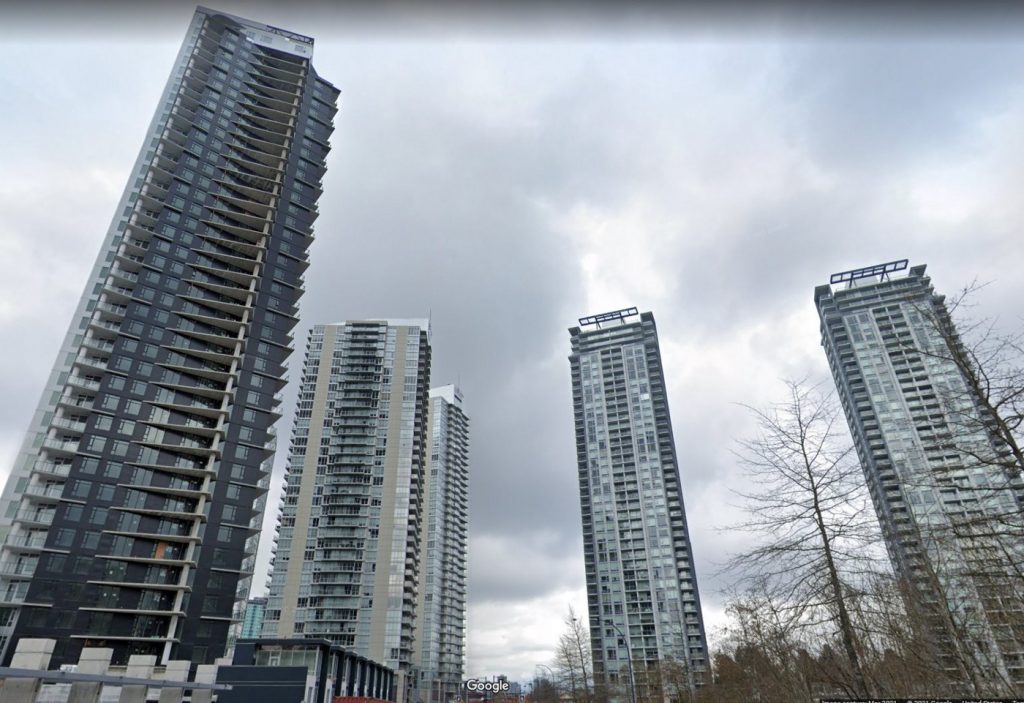 A photo of four tall residential towers in Surrey, BC.