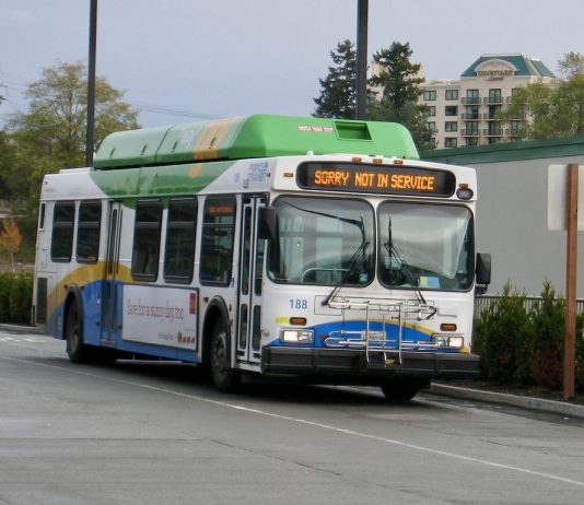 Pandemic Impacts Force Pierce Transit Service Reductions A white, blue, and green bus runs with a not in service sign.