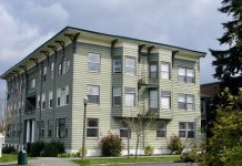 Latest Tacoma Growth Map Scales Back Density A photo of a light green gray three story apartment building.
