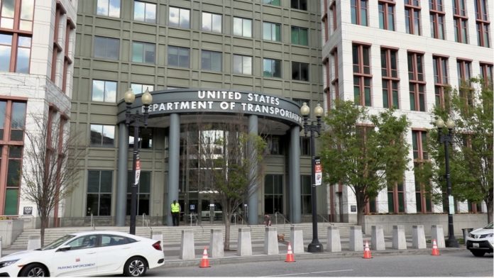 A photo showing the main entrance to the U.S. Department of Transportation building
