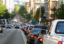 Mayor Durkan Poses as Climate Mayor at COP26 A photo of backed up car traffic on the right side of the road. Cars are approaching on the left side of the road.