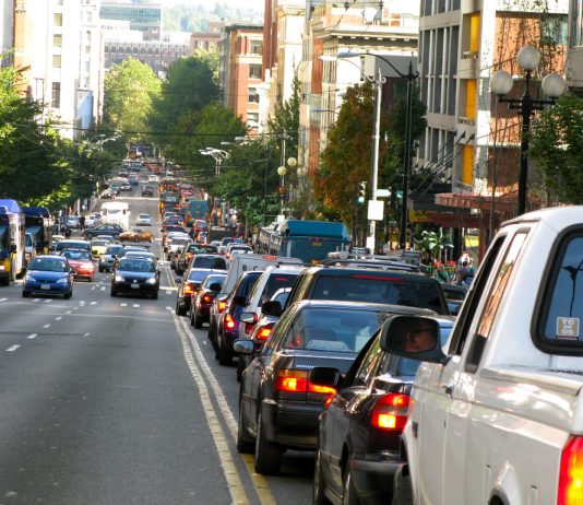 Mayor Durkan Poses as Climate Mayor at COP26 A photo of backed up car traffic on the right side of the road. Cars are approaching on the left side of the road.