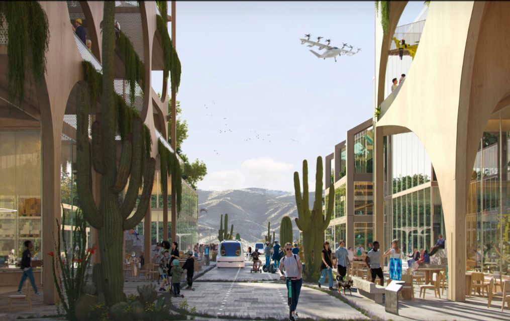 A rendering of a street with cacti. There are pedestrians, a person riding a scooter, and autonomous vehicles. An outdoor café is in front of the building. 