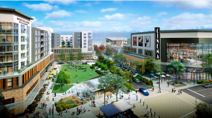 A rendering of residential and commercial buildings surrounding a town square.