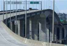 West Seattle High-Rise Bridge on Track to Reopen Mid 2022 A photo of a high bridge made of a concrete with a roadway.
