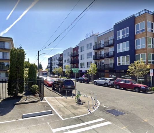 Seattle’s Crown Hill Action Plan Centers Walkability and Community A photo of a street with a crosswalk and curb bulbs near apartment buildings.