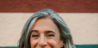 A photo a woman with grey hair wearing a black blazer.