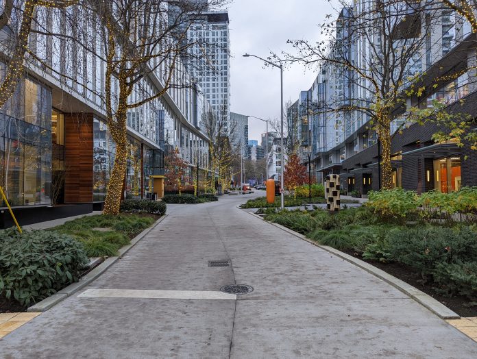 The 8th Ave N festival street surrounded by two newer office buildings, looking southward