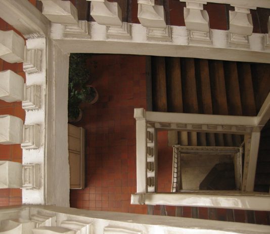 Seattle’s Lead on Single Stair Buildings A photo looking down a multi-level staircase