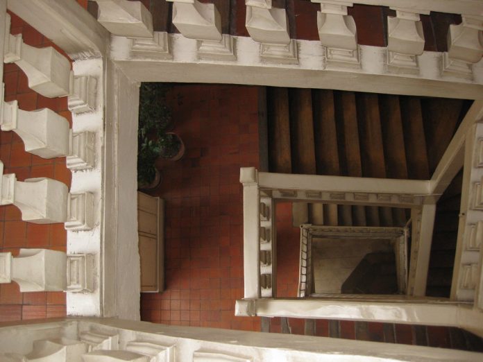 Parisian apartment building staircase A photo looking down a multi-level staircase