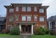 With Cuts and Changes, City Council Passes Home in Tacoma A brick apartment building.
