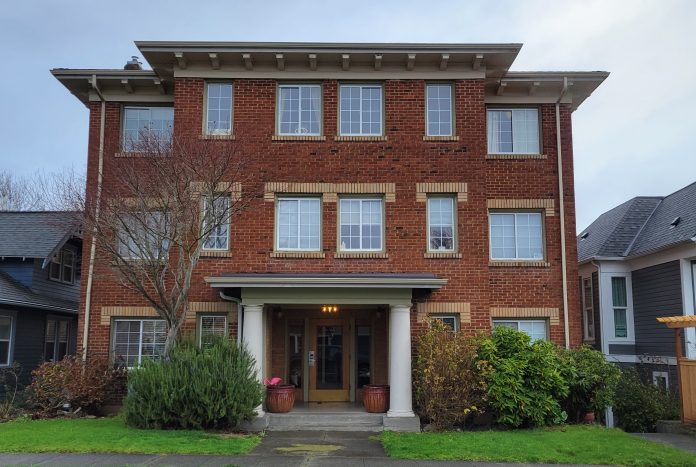 Tacoma apartment A brick apartment building.