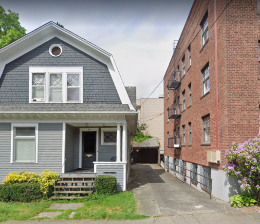 Voter Turnout Maps Tell Tale of Two Cities: Urban and Suburban A photo of a single family dwelling and an apartment building separated by an alley.