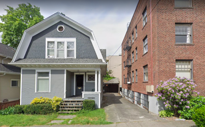 Tale of Two Cities in District 3 Seattle A photo of a single family dwelling and an apartment building separated by an alley.