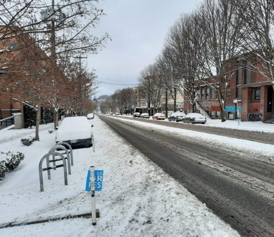 Seattle Needs a Truly Multimodal Snow Clearance Plan A view of Stone Way from the 38th crosswalk. Nothing is cleared but one car travel lane in each direction.