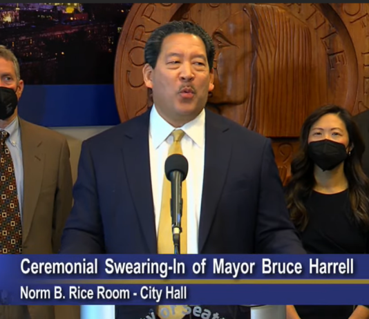 Harrell Pledges Bold Agenda in Inaugural Speech Harrell is flanked by his executive team including Deputy Mayors Kendee Yamaguchi and Monisha Harrell and Director of Strategic Initiative Tim Burgess to the right and Policy Director Dan Eder to the left.