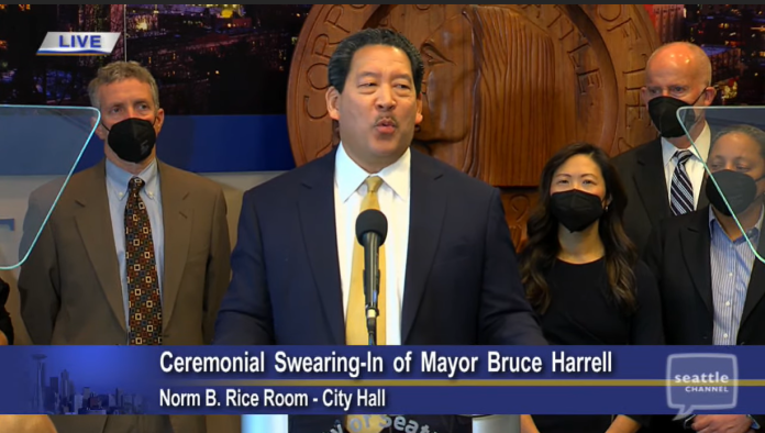 Seattle Mayor Bruce Harrell at Signing In Ceremony Harrell is flanked by his executive team including Deputy Mayors Kendee Yamaguchi and Monisha Harrell and Director of Strategic Initiative Tim Burgess to the right and Policy Director Dan Eder to the left.