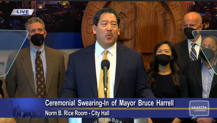 Harrell is flanked by his executive team including Deputy Mayors Kendee Yamaguchi and Monisha Harrell and Director of Strategic Initiative Tim Burgess to the right and Policy Director Dan Eder to the left.