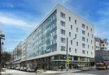 Call to Action: Speak Up For Housing Benefit Districts A photo of a white apartment building in an urban area.