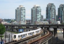 Driverless Metro: A Faster, More Reliable Alternative for Ballard and West Seattle A photo of an elevated metro line with modern towers in the background.