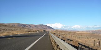 A close up view of a highway in an arid landscape.