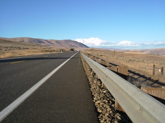 A close up view of a highway in an arid landscape.