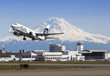 We Need to Try Everything But Build a New Airport Alaska Airlines plane takes off from Seattle-Tacoma International Airport with Mt. Rainier in the background.