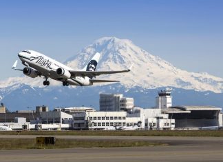 High Speed Rail Is a Solution for Terrible Airlines Alaska Airlines plane takes off from Seattle-Tacoma International Airport with Mt. Rainier in the background.