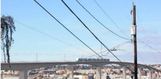 A rendering shows the elevated 14th Avenue NW alignment for Ballard Link.