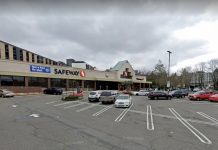 734 Homes Proposed in University Village Safeway Redevelopment Plans A photo of a low-rise grocery store with a surface level parking lot in front of it.