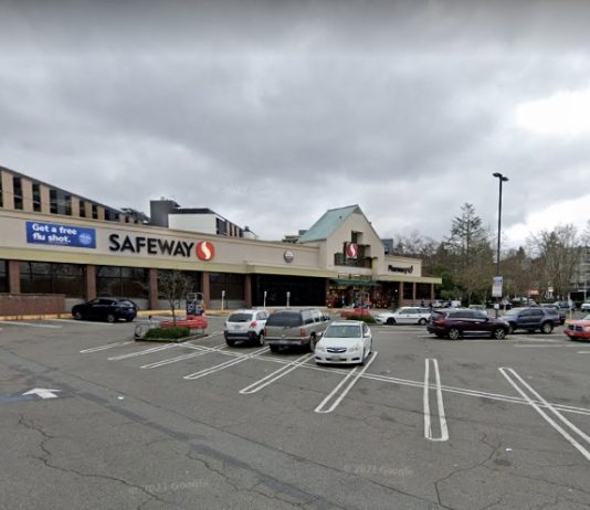 The Urbanist Podcast: Lots of Housing Going Up Above Seattle Safeway Grocery Stores A photo of a low-rise grocery store with a surface level parking lot in front of it.