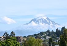 Seattle’s Geologic Hazards Can Be Overwhelming, But Preparation Can Start Now  A view of a mountain in the distance behind a suburban neighborhood