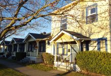 Poll Indicates Washingtonians Strongly Favor Statewide Missing Middle Housing Bill a photo of a small apartment building next to cottages