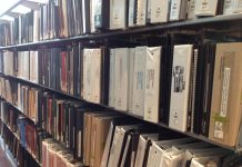 Neighborhood Plans are High Minded Gatekeeping A photo of books on a library shelves.