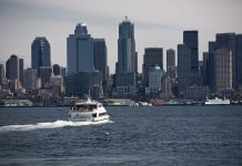 Transpo Notes: Bike Helmet Law Repeal, New Water Taxi Routes Report, Amtrak Cascades to Restore B.C. Service A photo of a water taxi in Elliot Bay near Downtown Seattle