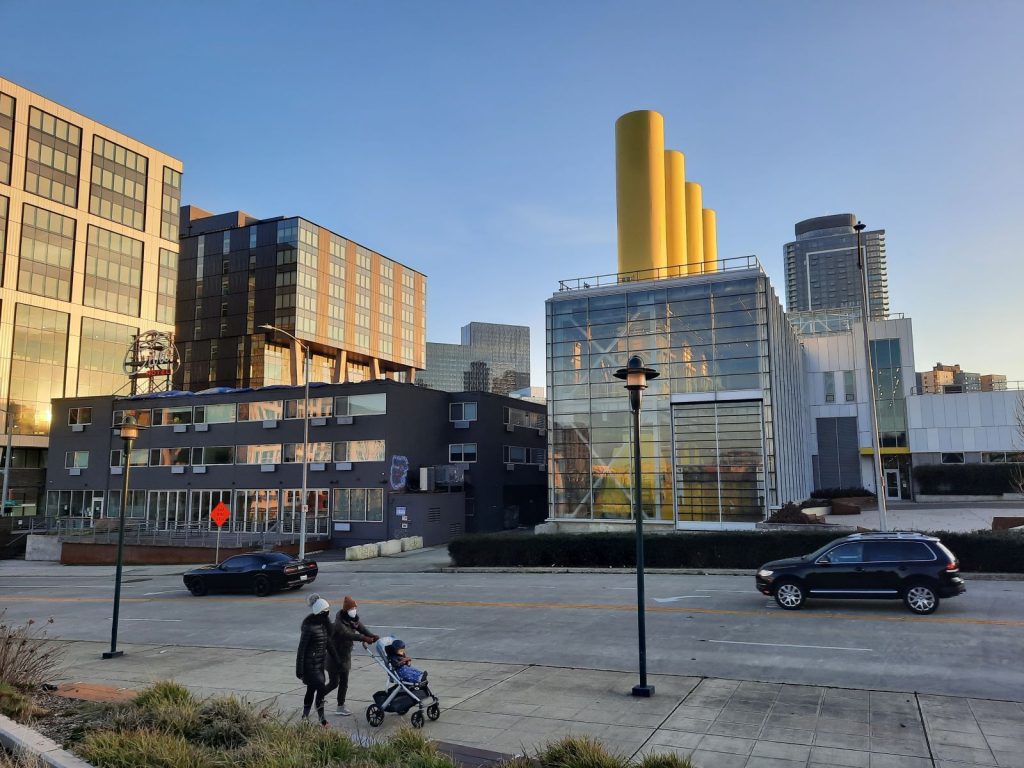 Four yellow tubes jut out of a two-story glass building on Harrison Street.