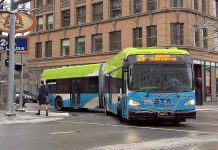 Welcome to the Move Ahead Washington Era An articulated Route 25 bus in Spokane makes a turn on a downtown street after yielding to a passing pedestrian.