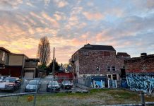 Seattle Tightens Regulations on Tree Service Providers A mural of sasquatch adorns a brick wall in a Greenwood alley.