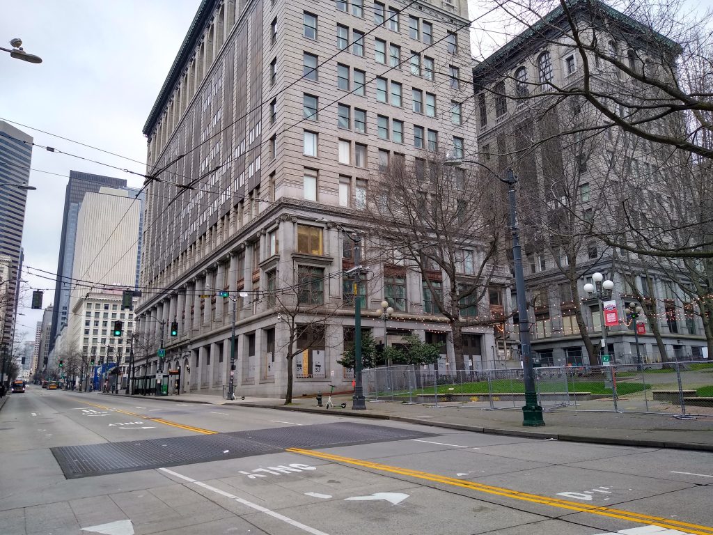 Photo from the crosswalk looking north from 3rd and Yesler with two lanes in each direction.